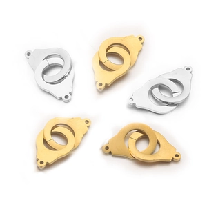Close-up of gold and silver handcuff style connectors for stainless steel jewelry DIY