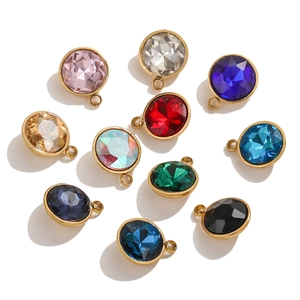 Detail of 9mm round and oval colorful glass pendants with 18K gold plated borders
