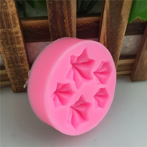 Pink silicone mold with five star-shaped cavities for fondant cake decoration