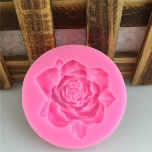 Pink round silicone mold with detailed rose pattern for DIY fondant cakes and soaps