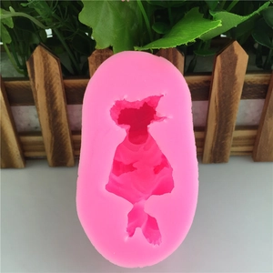 Pink silicone mold featuring a long-haired girl in a dress for fondant and DIY crafts