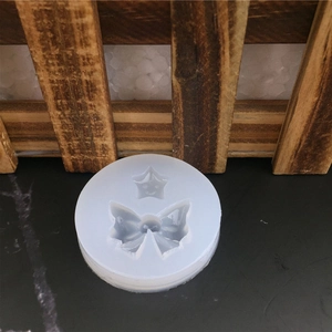 Moule en silicone avec formes d'étoile souriante et de nœud pour fondant et artisanat