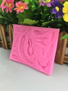Pink feather and wing silicone mold for DIY fondant cake decoration and clay crafting