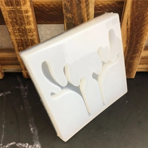 Detailed view of white silicone mold featuring intricate deer antler carved patterns