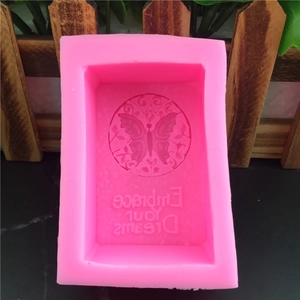Pink rectangular silicone mold featuring a butterfly and Embrace Your Dreams engraving