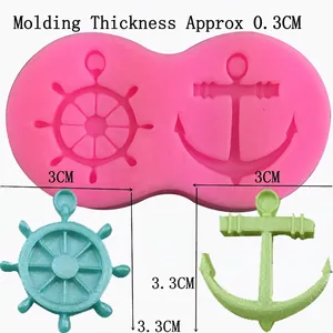 Pink silicone mold with anchor and helm shapes for DIY nautical cake decorations
