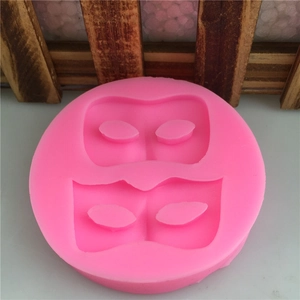 Stampo rotondo in silicone rosa con motivi a maschera per decorazione torte e fondente
