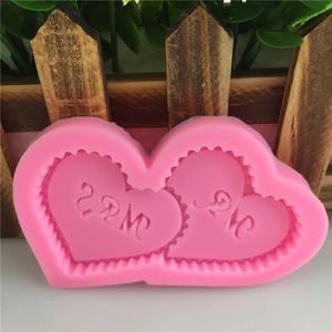 Pink silicone mold with double heart shapes and MR MRS lettering for cake decorating