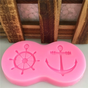 Pink silicone mold featuring anchor and ship wheel shapes for fondant and DIY cake baking