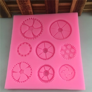Rosa Silikonform für Fondant mit acht verschiedenen Zahnradmustern zum Backen und Basteln