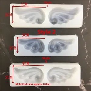 Three sizes of angel wing silicone molds for fondant, cake and resin crafts on marble