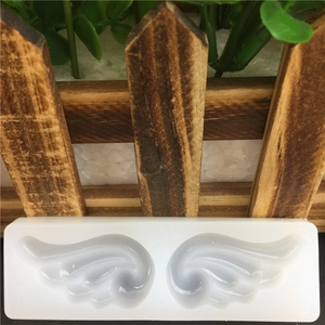 White silicone angel wing mold for fondant cake decorating and DIY craft textures