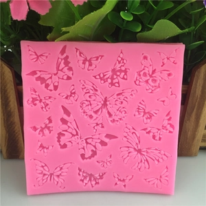 Pink silicone butterfly mold for fondant and cake decorating with multiple patterns