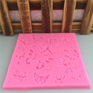 Pink silicone butterfly mold with various shapes for fondant cake decorating and DIY