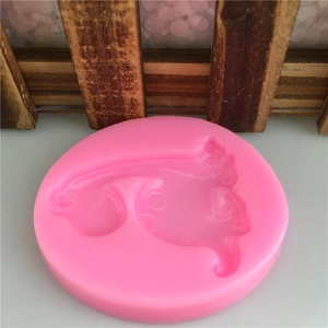 Stampo circolare in silicone rosa con forme di dinosauro per fondente e decorazioni torte