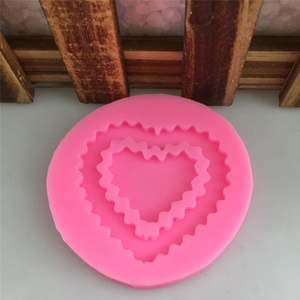 Pink heart-shaped silicone mold with fine wavy edges for fondant and DIY crafts