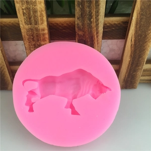 Pink round silicone mold featuring a detailed bull shape for DIY cake fondant and crafts