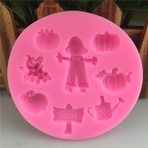 Pink silicone mold featuring 8 rural themes including pumpkin patch and scarecrow shapes