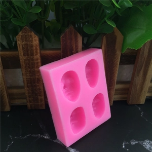 Pink silicone mold with four facial mask shapes for DIY fondant cakes and craft making
