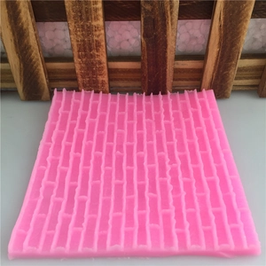 Pink silicone fondant mold with castle brick wall texture for cake decorating and DIY baking