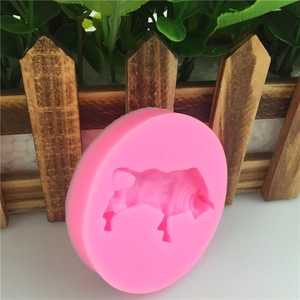 Pink circular silicone mold featuring a detailed bull shape for DIY cake decorating crafts