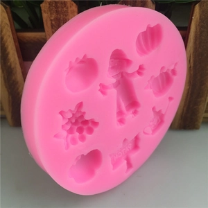 Pink silicone mold featuring pumpkin, scarecrow and corn designs for DIY baking cakes