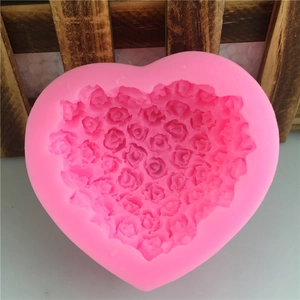 Pink heart-shaped silicone mold with detailed rose flower texture for cake baking decoration