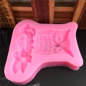 Pink owl silicone mold on a tree branch for fondant cake decorating and DIY soap making