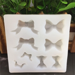 Bow tie shaped silicone fondant mold with 8 cavities for cake decoration and soap making