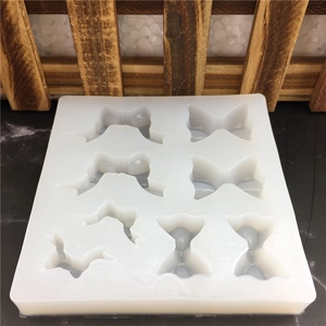 Translucent white silicone mold with diverse bow designs for fondant cake and soap crafts