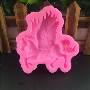 Pink silicone Pegasus mold for fondant and cake decoration with detailed wings and texture