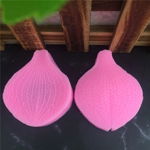 Pink silicone leaf vein fondant molds for DIY cake decorating and pastry making