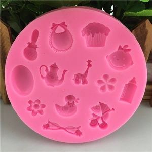Pink silicone baby theme fondant mold for DIY baking with carriage and rattle shapes