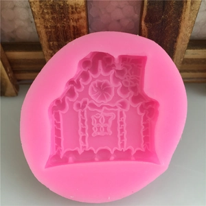 Pink silicone fairy house mold with detailed roof and window patterns for DIY cake baking