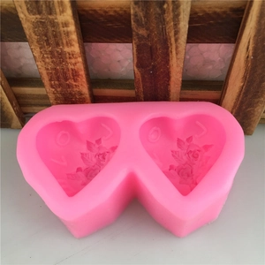 Pink heart-shaped silicone mold with LOVE letters and rose embossed floral patterns