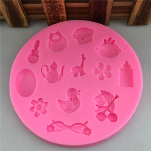 Pink silicone baby shower themed fondant mold with giraffe, teapot, and stroller shapes