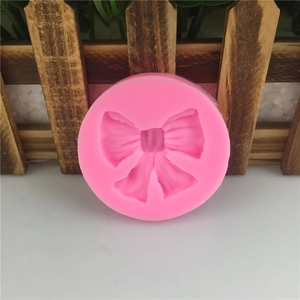 Moule en silicone rose avec formes de nœuds pour fondant et décoration de gâteaux