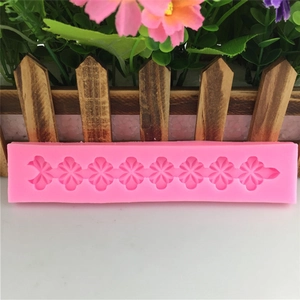 Pink silicone mold with eight cherry blossom floral patterns for DIY cake fondant and baking