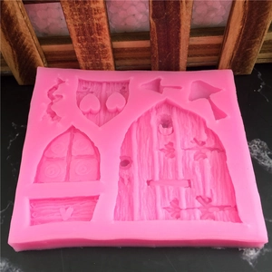 Pink silicone mold with fairy door mushroom and window designs for cake fondant decorating