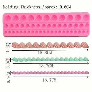 Pink silicone mold for shell border fondant cake decorations with sizing dimensions