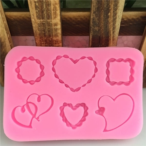 Pink 6-cavity silicone mold with heart, square, and round shapes for fondant cake decorating
