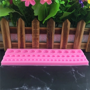 Pink silicone mold featuring wheat spike patterns for fondant and cake decoration