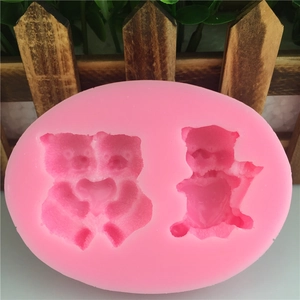 Pink silicone mold featuring two bear designs with heart for fondant and chocolate cake decoration
