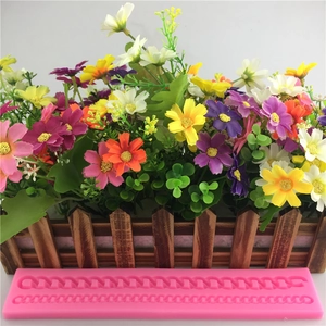 Pink silicone fondant mold with chain and braided patterns for decorative cake border design