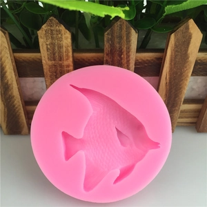 Pink round silicone mold featuring detailed angelfish design for DIY fondant and baking
