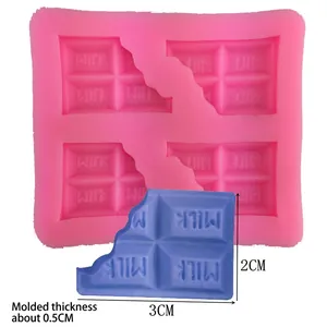 Pink silicone chocolate bar mold with MILK lettering and sample piece for DIY baking