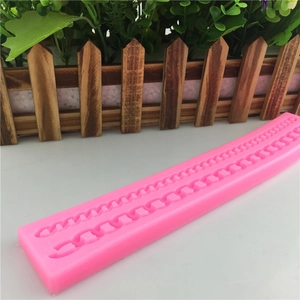 Pink silicone cake border mold with pearl and braided textures for fondant decoration