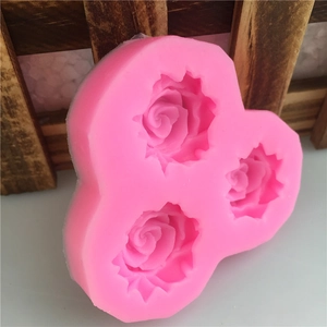 Pink silicone mold with three 3D rose flower cavities for fondant cake and soap making