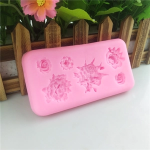 Pink silicone mold with six floral patterns for soap, chocolate, and resin crafting