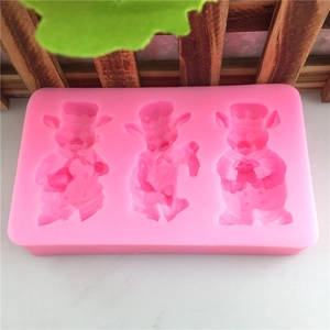 Stampo in silicone rosa con tre motivi di maialini chef per fondant e pasticceria